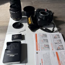 Nikon D3100 camera with two lenses 