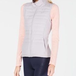 New with tag Nike Essential Running Vest size XS   Protect your core with this lightweight vest from Nike, in cozy Therma fabric with body-mapped insu