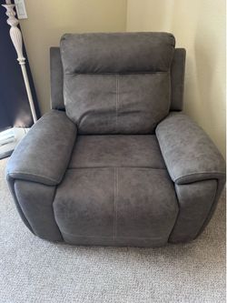 Brown power recliner chair.
