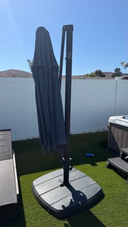 Large umbrella. Needs repair.