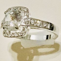 Gorgeous ladies ring CZ Center Stone and surrounded by smaller CZ