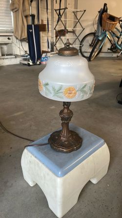 Antique style lamp with glass shade