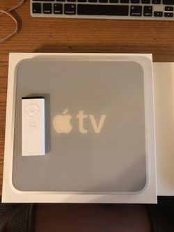 Apple TV  OG Version - w/ remote. Has some Harry Potter and Disney movies