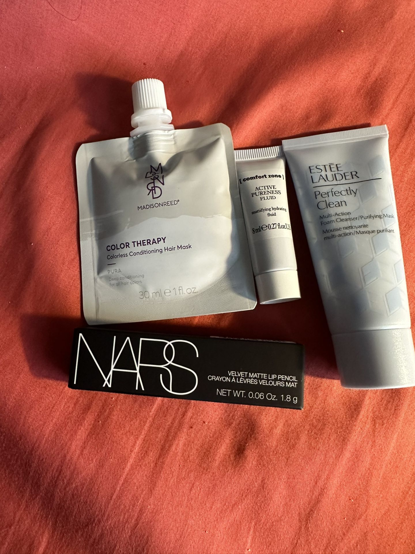 4 beauty products. Estée Lauder, Nars Matte Lip Pencil, Madisonreed hair mask, Comfort Zone