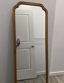 Arched wooden mirror