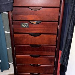 solid wood tall dresser with a rich dark cherry finish and 10 slim drawers