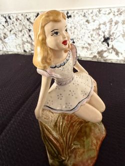 Beautiful Blonde Girl In A White Dress Sitting On A Tree Stump Ceramic Figurine