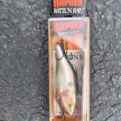 This is a Rapala Rattlin' Rapala RNR-7 fishing lure in the Shad color finish