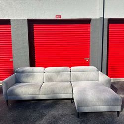 MODERN GREY FABRIC SECTIONAL COUCH/ 2 PIECES/ HEADRESTS ARE ADJUSTABLE/ IN GOOD CONDITION/ DELIVERY NEGOTIABLE 