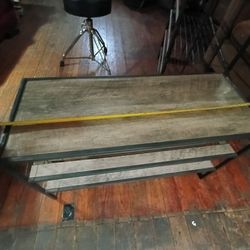 Small wooden and steel table with selfs