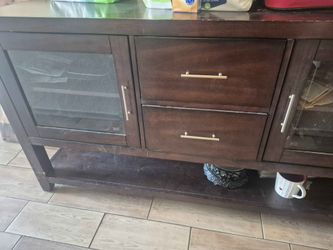 dark wood entertainment console or media stand