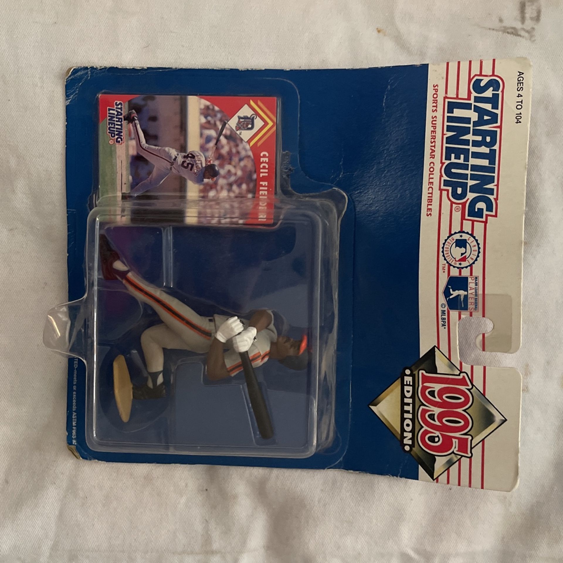 This Kenner Starting Lineup action figure depicts Cecil Fielder, a legendary baseball player for the Detroit Tigers in 1995. The figure is made of pl