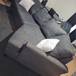 Grey Couch With 2 Pillows