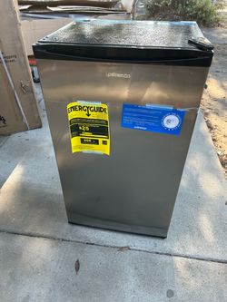Brand new mini refrigerator with freezer