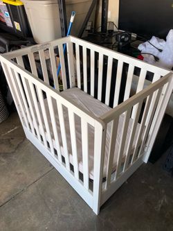 Carter’s by DaVinci Colby 4-in-1 Convertible Mini Crib with Storage Drawer + Mattress