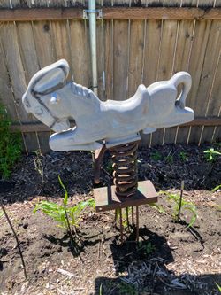 Vintage cast iron park playground horse.