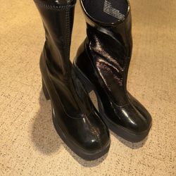Black glossy ankle high boots