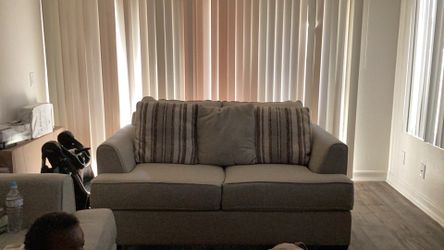 Two piece beige couch set.