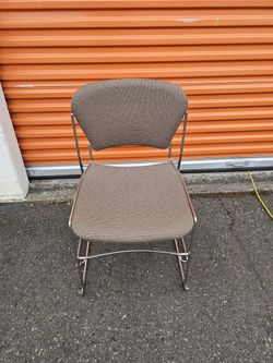 Brown Upholstered Chair - Reclining Back & Stackable