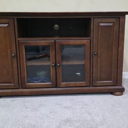 Corner TV stand (also called a corner media console or corner entertainment cabinet)