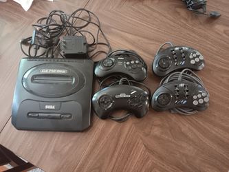 Sega Genesis with cords and 4 controllers