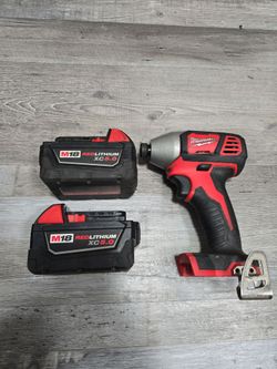 2... MILWAUKEE BATTERYS XC5.0 AND IMPACT DRIVER