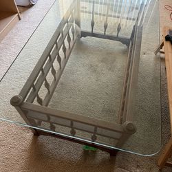 Vintage 1980s glass top coffee table with wooden base