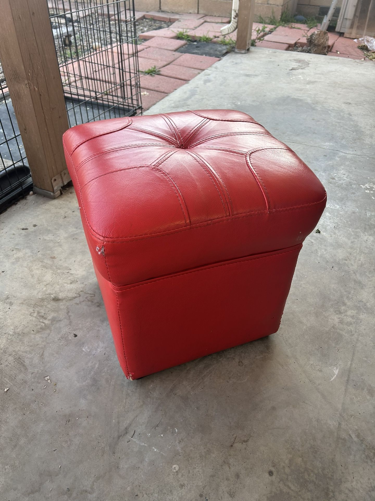 Tiny red stool with cushion