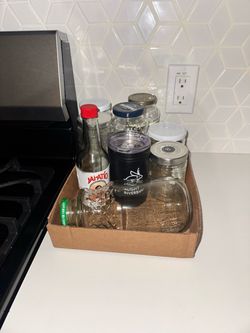 Glass jars and small insulated cup