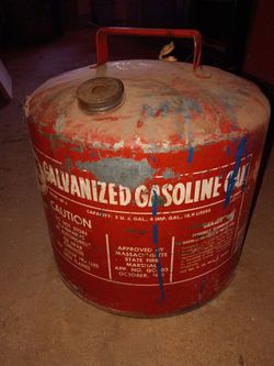 Large antique metal 5 gallon gas cans