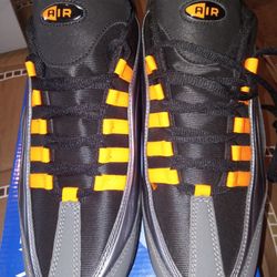 A Brand New Pair Of Dark Grey And Yellow Tennis Shoes, Eagle Air Brand 