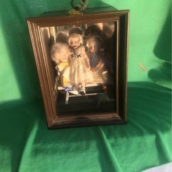 Three Antique Dolls Sitting On Bench