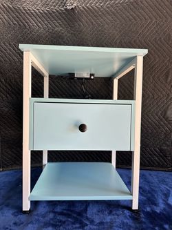 Side table with USB ports and plugs