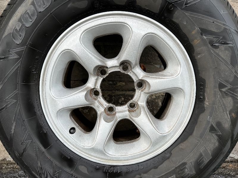 One Mitsubishi 15x7 inch Aluminum wheel And tire 6 lugs fits Nissan ...