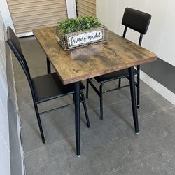 Table And 2 Leather Chairs