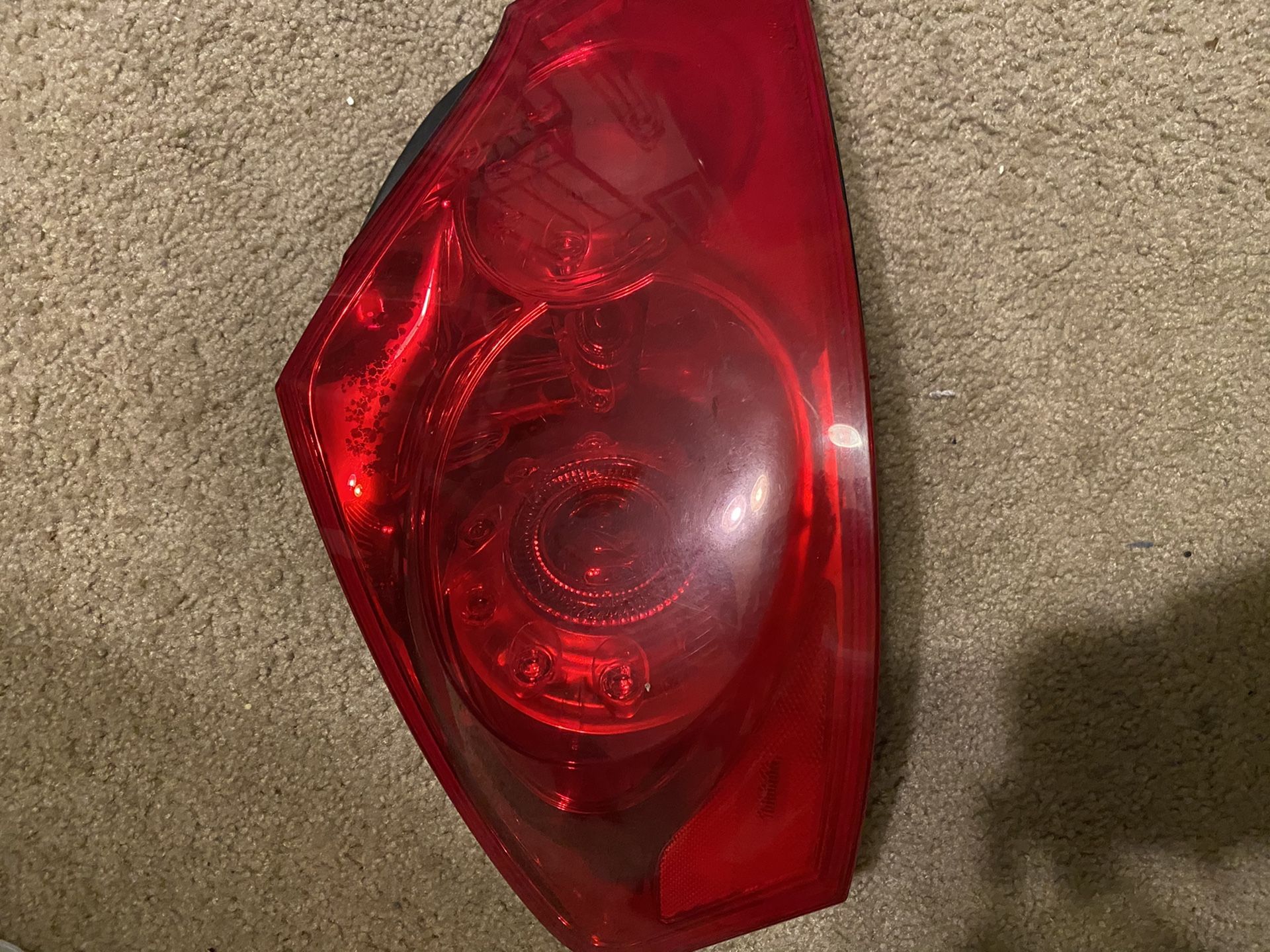 Infiniti G37 sedan driver side tail light