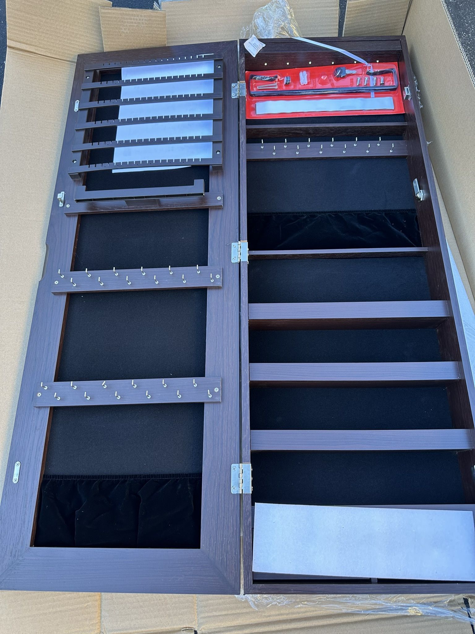 Wall cabinet with jewelry mirror