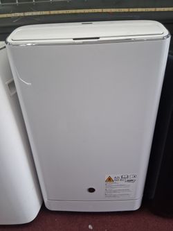 14000btu portable AC/ HEATER both by GE.  Complete Set with windows hose and remote Control.  New