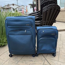 Two Samsonite suit cases