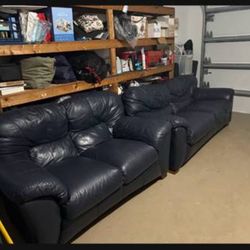 Navy blue leather sofa and loveseat