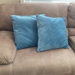 Two blue decorative pillows