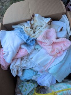 Box of baby clothes