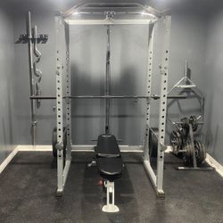Squat Rack With Weights, Bars, And Adjustable Bench