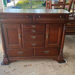 brown cabinet with mirror head board
