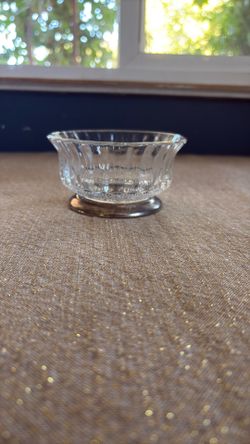 Glass candy bowl with a silver foot 