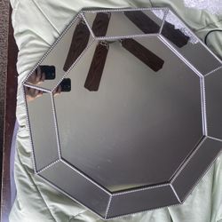 octagonal wall mirror features a unique beaded frame design