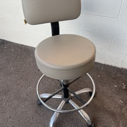 Beige adjustable swivel chair