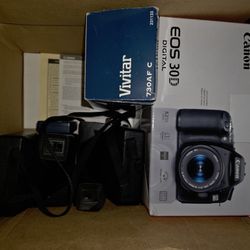 2 Polaroid Cameras And A Canon Camera