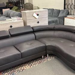 New Curved Leather Sectional W Adjustable Headrests.  105x85.  Free Delivery!