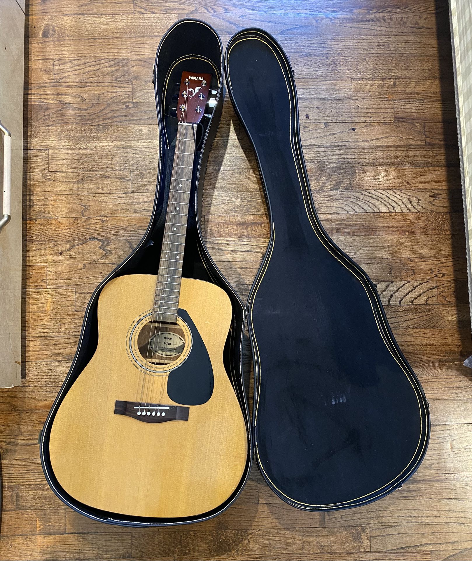 YAMAHA ACOUSTIC GUITAR F-310. Used one string loose. In good condition